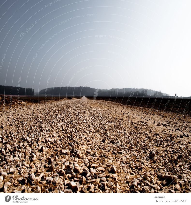 The straight path Traffic infrastructure Street Lanes & trails Infinity Blue Gray Gravel Gravel path Exterior shot Deserted Copy Space top Day Sunlight