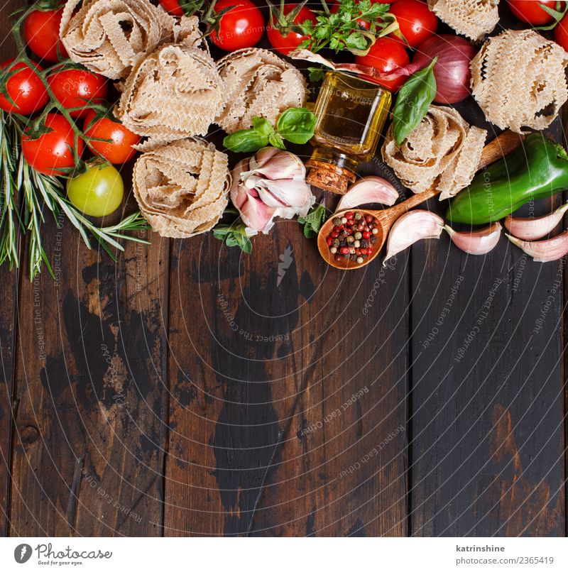 Fresh raw vegetables and herbs on a wooden background Vegetarian diet Diet Table Leaf Dark Brown Green Red cooking food health healthy Ingredients Rustic Tomato