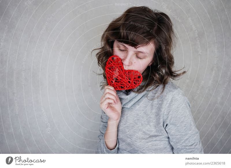 Young woman holding a red heart Design Healthy Wellness Harmonious Senses Relaxation Calm Human being Feminine Youth (Young adults) 1 18 - 30 years Adults