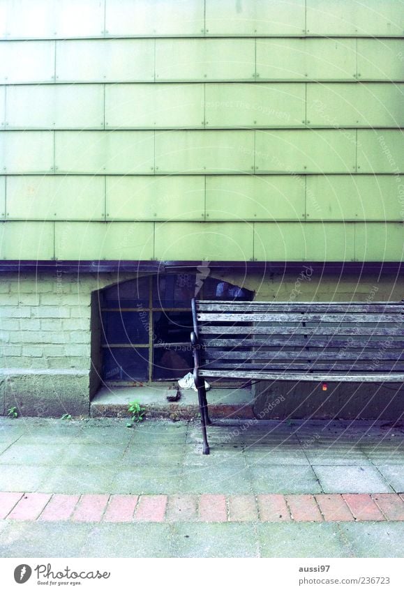 Getting on the wrong track Bench Old building Seating Relaxation Break Restful Broken Loneliness Cellar window Copy Space top Tilt Deserted Street Sidewalk