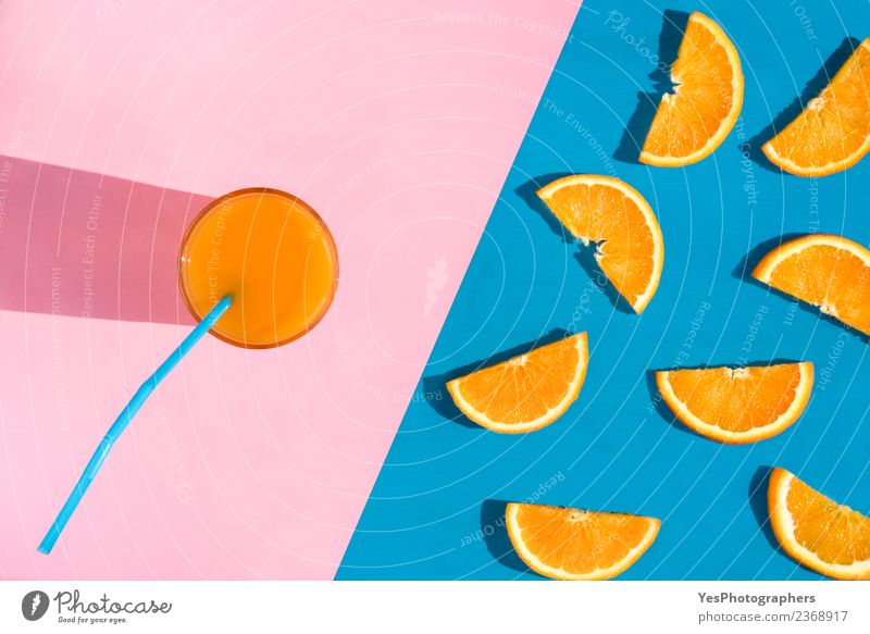 Glass with orange juice Fruit Orange Breakfast Diet Beverage Cold drink Juice Summer Fresh Healthy Delicious Juicy Pink Colour above view Blue background citrus