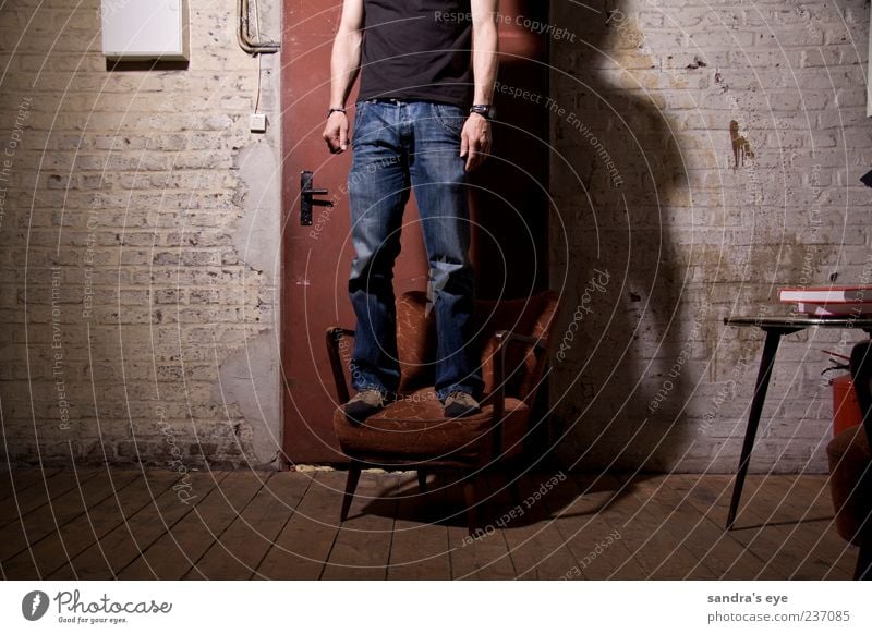 doormen Armchair Human being Masculine Man Adults 1 Factory Door Clothing T-shirt Jeans Wristwatch Footwear Stand Wait Thin Calm Red Blue Wall (building)