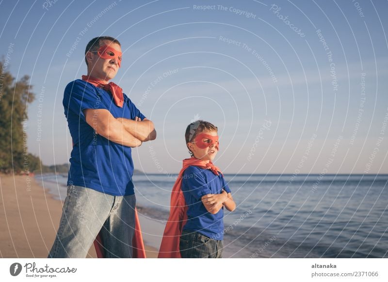 Father and son playing superhero on the beach at the day time. Lifestyle Joy Happy Relaxation Leisure and hobbies Playing Vacation & Travel Adventure Freedom