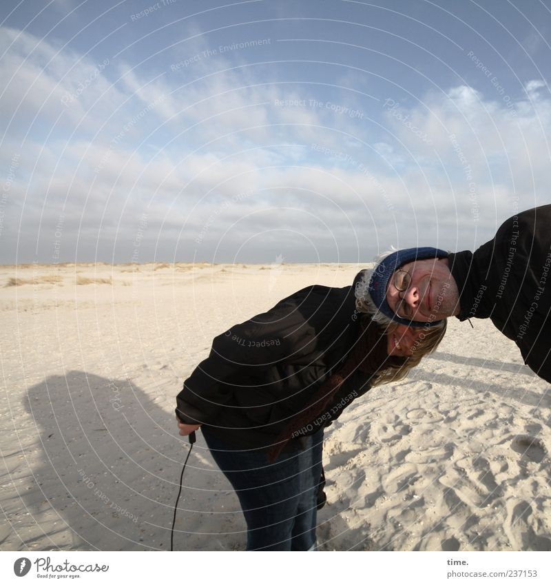 Spiekeroog ... like two pigs in front of the clock. Beach Woman Adults Man Sand Sky Relationship Release Stoop Exterior shot Looking Funny