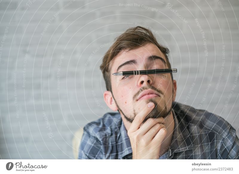 Young man working at a desk in business sector Elegant Sofa Table Work and employment Office Business Computer Notebook Technology Human being Man Adults Places