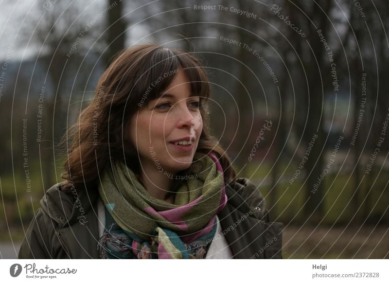 Portrait of a young woman with long brunette hair in half profile Human being Feminine Young woman Youth (Young adults) Adults Head Hair and hairstyles Face 1