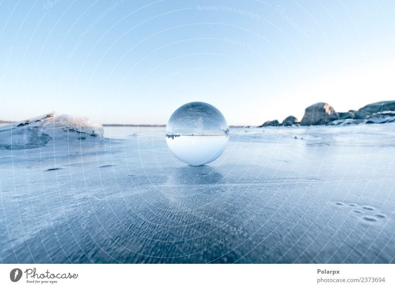 Elegant glass orb on ice on a frozen lake Design Beautiful Wellness Meditation Winter Snow Mountain Decoration Nature Landscape Sky Tree Rock Lake Globe