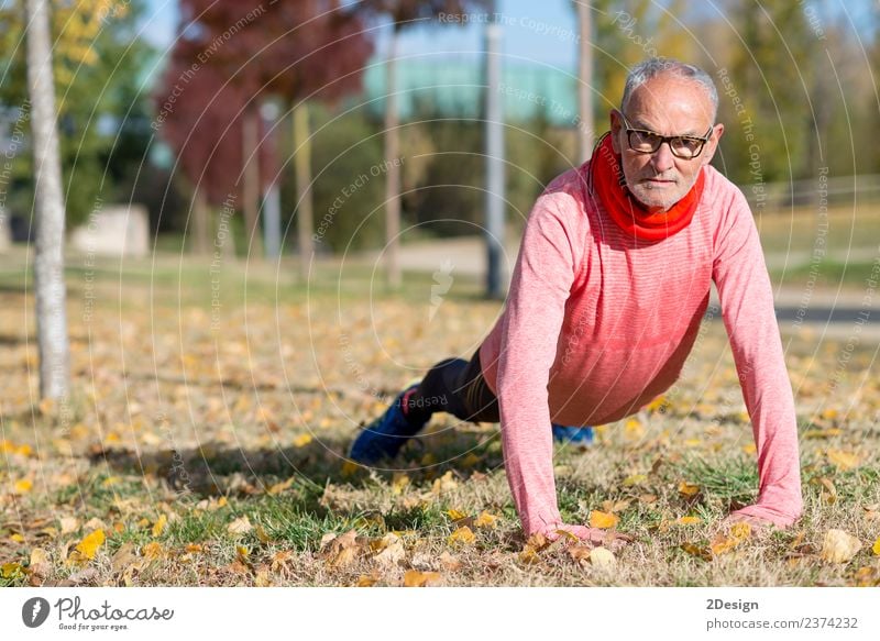 Senior Man Exercising In Park Diet Lifestyle Body Athletic Fitness Leisure and hobbies Summer Sports Track and Field Sportsperson Jogging Human being Masculine