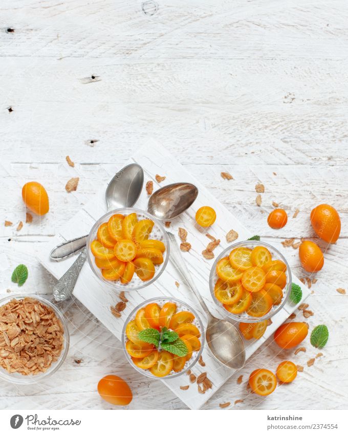 Chia pudding parfait, layered with kumquat and granola Yoghurt Fruit Dessert Eating Breakfast Diet Bowl Spoon Bright Above Green White Colour Cereal chia