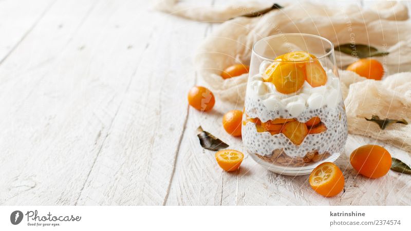 Chia pudding parfait, layered with kumquat and granola Yoghurt Fruit Dessert Eating Breakfast Diet Bowl Spoon Bright Green White Colour Cereal chia Pudding seed