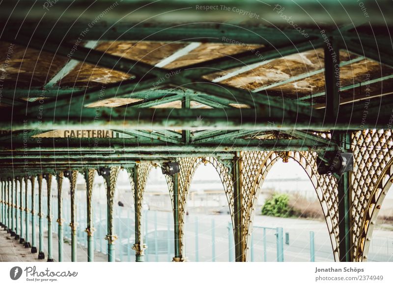 Cafeteria sign on promenade coast Brighton Coast beach promenade arched gateways bows Outskirts dwell England Dreary Handrail turquoise Wall (barrier) rampart