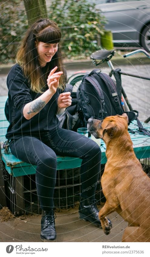 Woman with dog in the city Happy fortunate Joy Smiling Lifestyle Young woman Adults 18 - 30 years Youth (Young adults) Hair and hairstyles Contentment