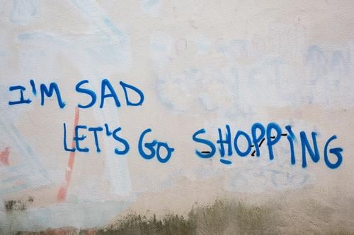 Consumption as a substitute satisfaction for depression and sadness. Grafitti writing in english consume SHOPPING Lifestyle Shopping Luxury Mind psyche Sadness