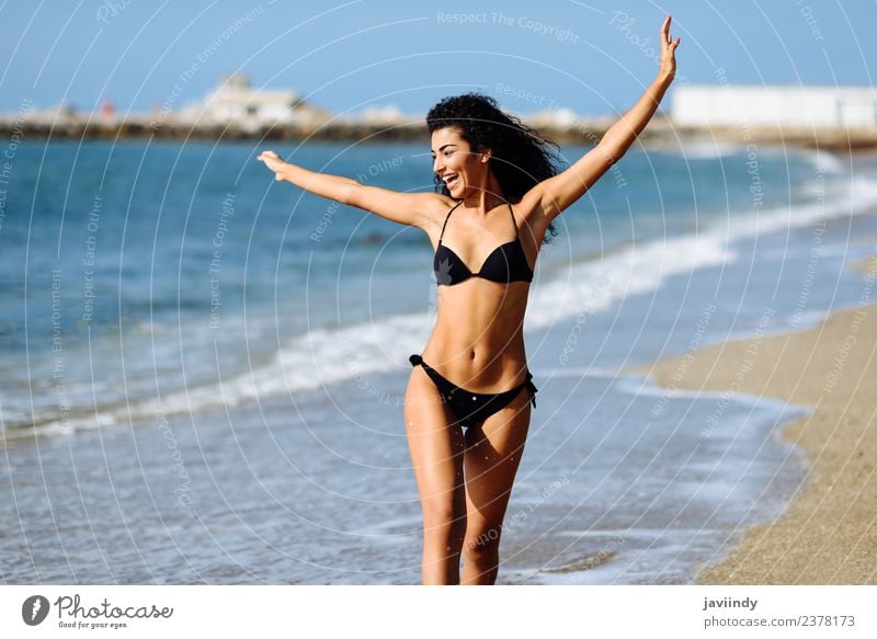 Young woman in bikini on a tropical beach with open arms. Lifestyle Beautiful Body Leisure and hobbies Vacation & Travel Tourism Summer Beach Feminine