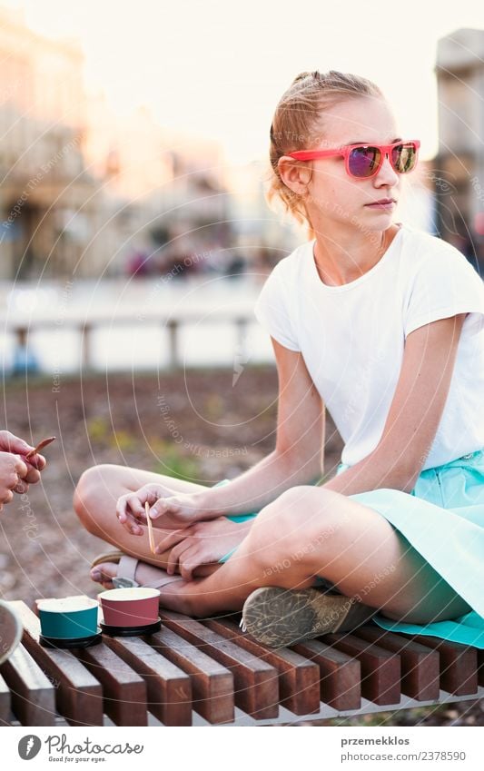 Young girl spending time in the city centre Dessert Ice cream Eating Lifestyle Joy Happy Beautiful Leisure and hobbies Vacation & Travel Summer Young woman