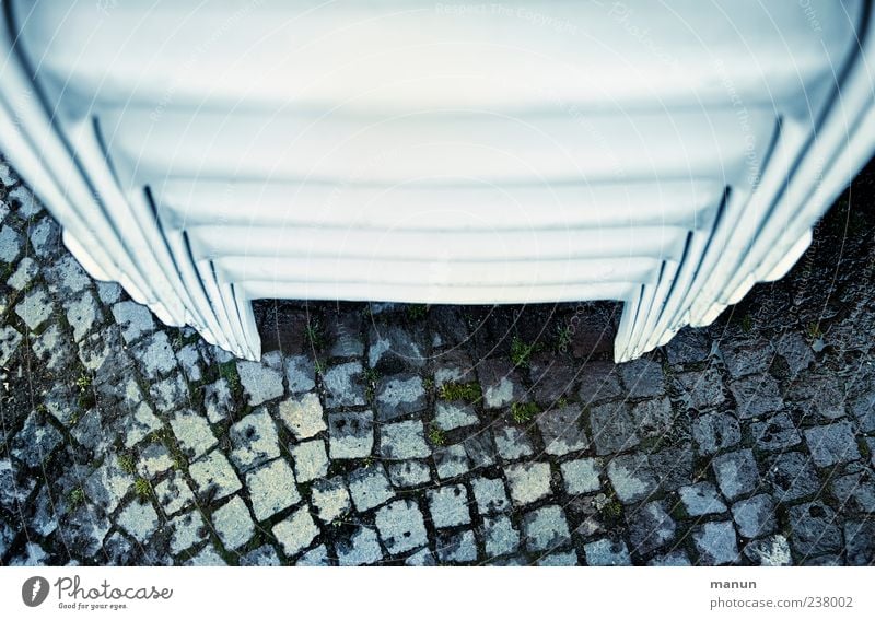 confidence man Chair Garden chair Stack Many Multiple Cobblestones Stand Authentic Colour photo Subdued colour Exterior shot Deserted Copy Space top