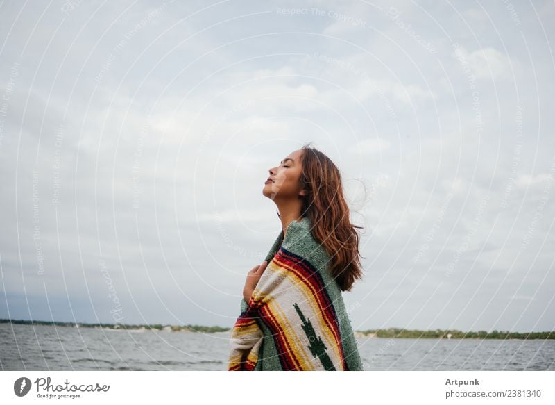 A young woman wrapped in a blanket (horizontal) Horizontal Sky Clouds Cold Blanket Nature Camping Hiking Vacation & Travel Woman 18 - 30 years Young woman Long