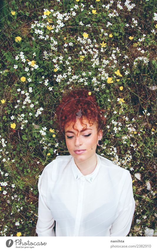 Young woman resting in a field of flowers Lifestyle Style Joy Beautiful Hair and hairstyles Healthy Wellness Harmonious Senses Relaxation Human being Feminine