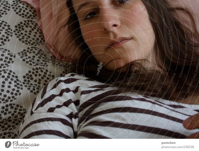 Woman lies in bed in a bad mood. Sad, depressed Feminine Young woman Youth (Young adults) Adults Hair and hairstyles Face Mouth 1 Human being 18 - 30 years