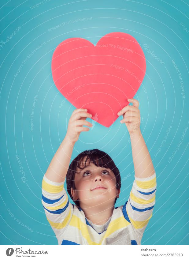 smiling boy with a heart on blue background Lifestyle Joy Party Event Feasts & Celebrations Valentine's Day Mother's Day Human being Masculine Child Toddler