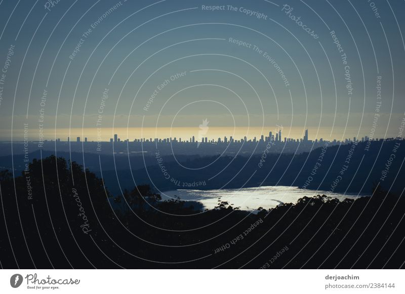View from the mountains . View from the Pass Höhe to Surfers Paradise with a small lake in the foreground . The skyscrapers seem very small. Queensland Joy