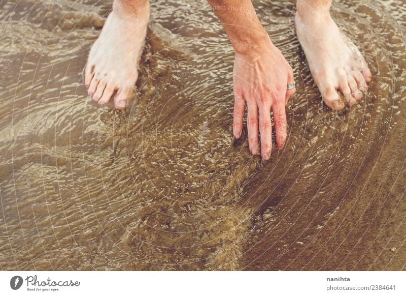 Man touching sea water during summer holidays Lifestyle Vacation & Travel Freedom Summer Summer vacation Beach Ocean Human being Masculine Young woman