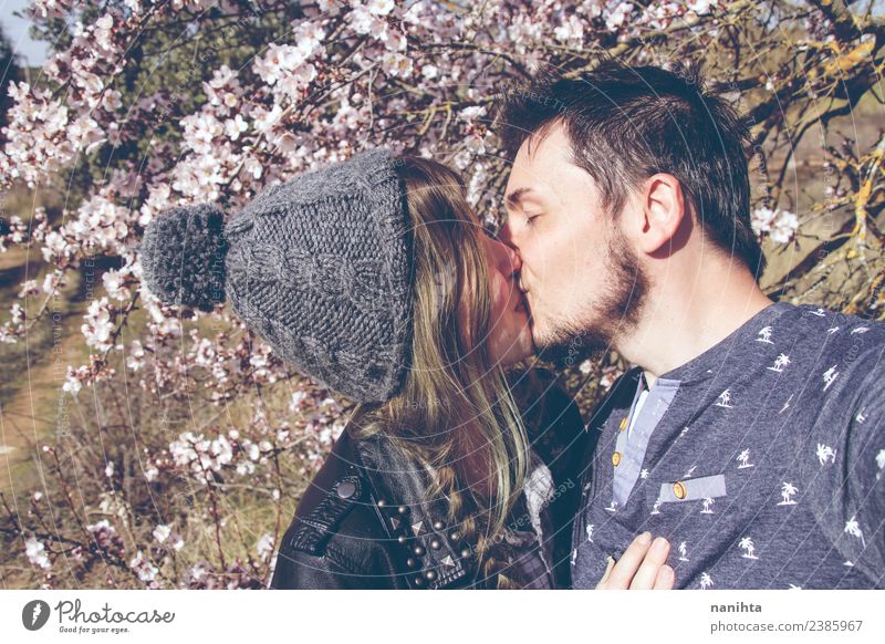 Young couple kissing in a sunny spring day Lifestyle Style Joy Wellness Harmonious Senses Human being Masculine Feminine Young woman Youth (Young adults)