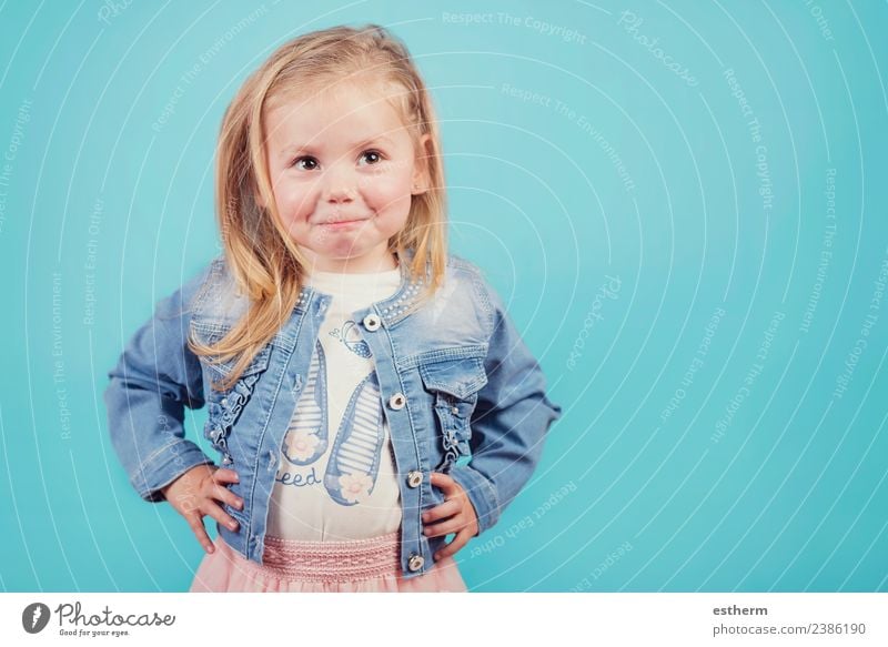 smiling baby on blue background Human being Feminine Baby Girl Infancy 1 3 - 8 years Child Observe Fitness Smiling Laughter Wait Happiness Cuddly Funny