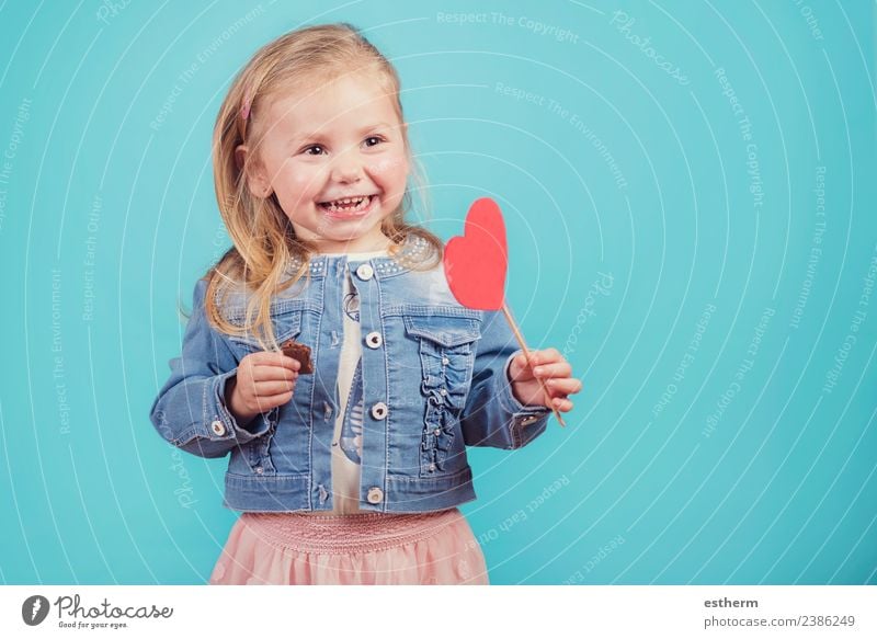 smiling baby with a heart on blue background Lifestyle Joy Feasts & Celebrations Valentine's Day Mother's Day Human being Feminine Baby Girl Infancy 1