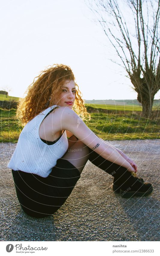 Young woman sitting in a road at sunset Lifestyle Style Hair and hairstyles Wellness Senses Relaxation Calm Human being Feminine Youth (Young adults) 1