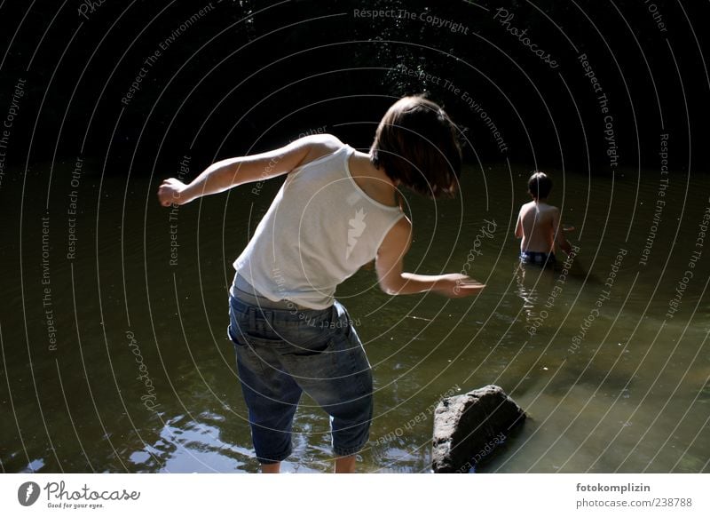 Children throwing stones at the lake Boy (child) Infancy children Youth (Young adults) Water Lake Swimming & Bathing Throw Free Happiness Emotions Moody