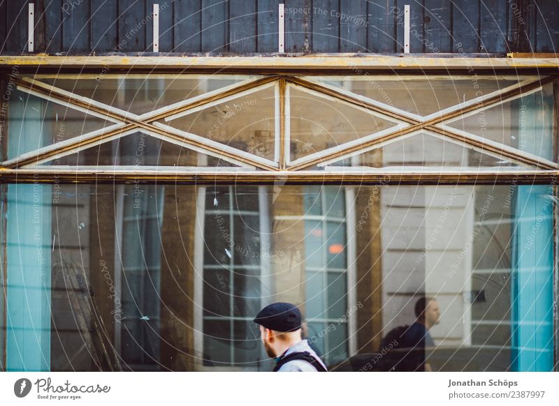 young man walks along glass facade Lifestyle Design Vacation & Travel Tourism Sightseeing City trip Masculine Brighton Great Britain Europe Town