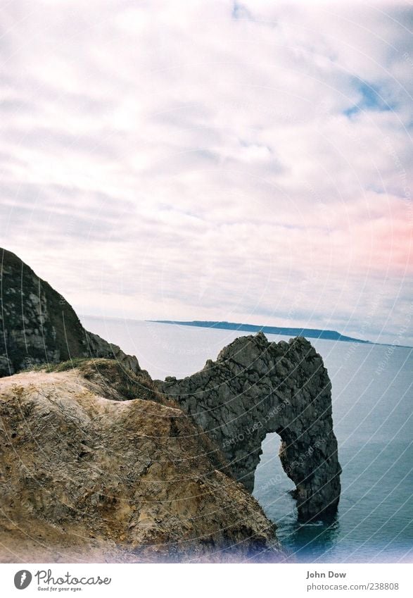 Durdle Door Far-off places Freedom Landscape Beautiful weather Hill Rock Coast Bay Ocean Exceptional England Dorset Vantage point Clouds Cloud cover