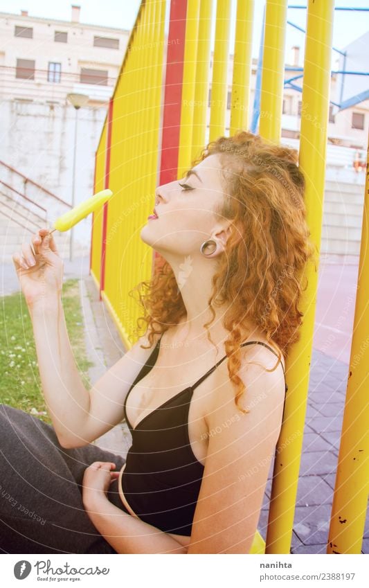 Young woman outdoors eating a lemon ice cream Food Ice cream Eating Vegetarian diet Lifestyle Style Beautiful Hair and hairstyles Human being Feminine