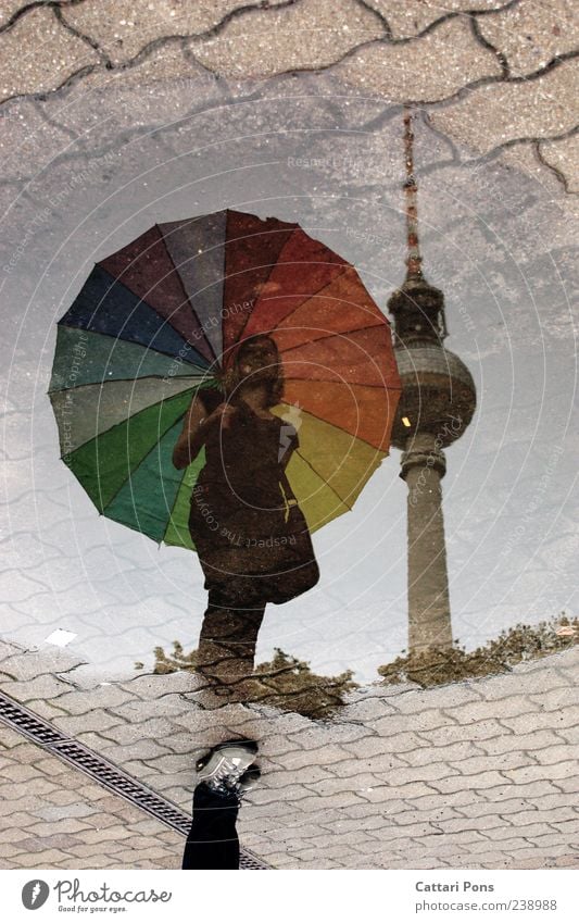 almost equal Feminine Young woman Youth (Young adults) Woman Adults Rain Capital city Tourist Attraction Stand Wet Thin Umbrella Multicoloured Puddle Reflection