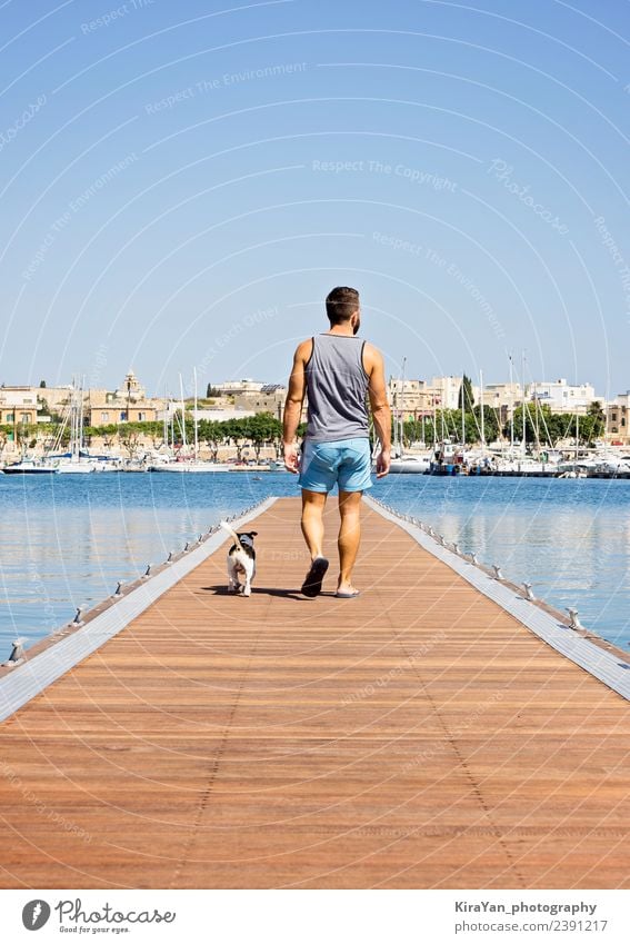 A man with a dog walking on the floating pier Happy Vacation & Travel Summer Sun Ocean Man Adults Friendship Nature Sky Autumn Coast Town Skyline Bridge Pet Dog