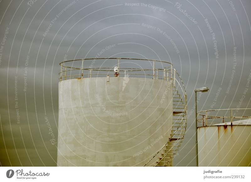 Iceland Industry Sky Clouds acranes Factory Manmade structures Stairs Dark Tank Round Colour photo Subdued colour Exterior shot Deserted Silo Industrial plant