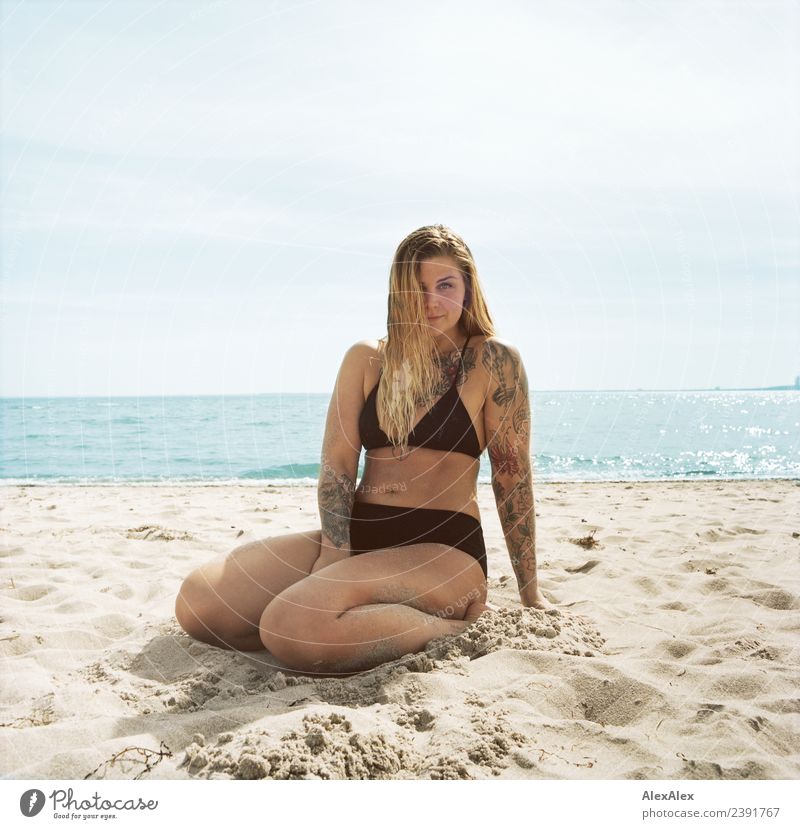 big woman sitting at the Baltic Sea beach Lifestyle Joy Beautiful Wellness Well-being Summer Summer vacation Young woman Youth (Young adults) 18 - 30 years