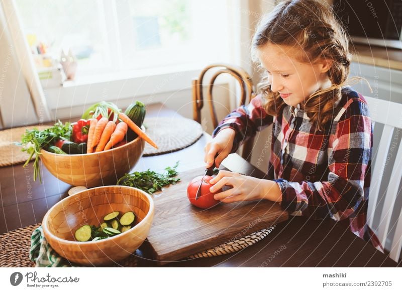 child girl helps mom to cook Vegetable Lunch Dinner Lifestyle Table Kitchen Child Mother Adults Family & Relations Growth Fresh Small Salad knife Cut Helper kid