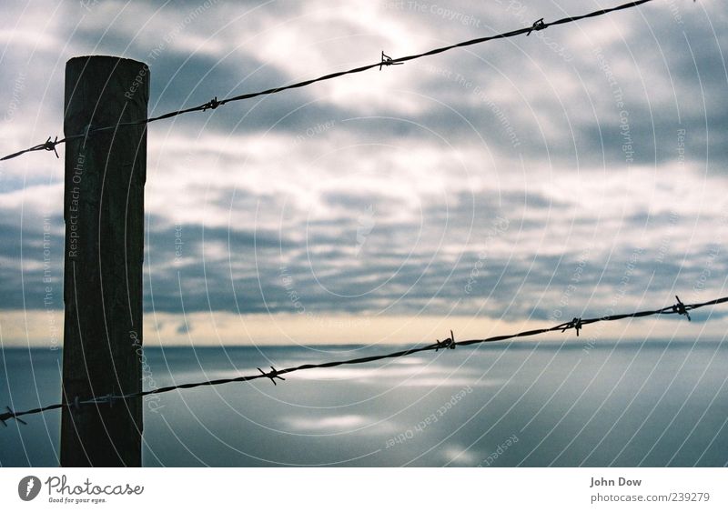 epiphany Trip Far-off places Freedom Sky Clouds Storm clouds Horizon Climate change Coast Bay Ocean Dark Mysterious Puzzle Transience Wire netting Captured