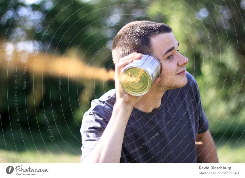 Yes, I'm listening! Children's game One young adult man Only one man Individual 1 Person Retro Retentive Central perspective Blur Contrast Day Exterior shot