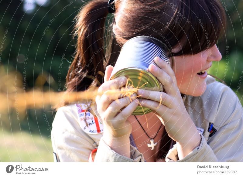 The joy of listening Technology Telecommunications Young woman Youth (Young adults) Life 1 Human being 18 - 30 years Adults Bush telephone Joy Laughter Scouts