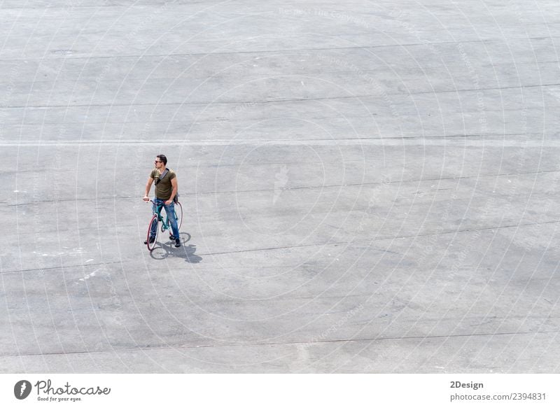 Young man standing with his bike on a square Lifestyle Vacation & Travel Tourism Human being Masculine Youth (Young adults) Man Adults 1 30 - 45 years