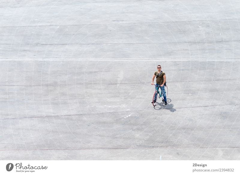 Young man standing with his bike on a square Lifestyle Vacation & Travel Tourism Summer vacation Human being Masculine Youth (Young adults) Man Adults 1