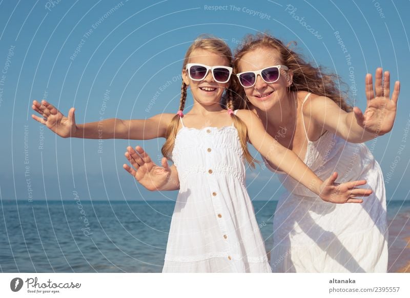 Mother and daughter standing on the beach at the day time. Lifestyle Joy Happy Relaxation Leisure and hobbies Playing Vacation & Travel Trip Freedom Camping