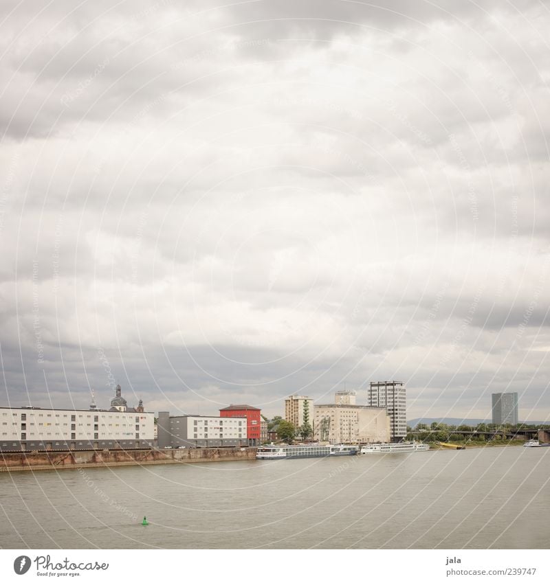 Rhine Sky Clouds River bank Town House (Residential Structure) High-rise Factory Manmade structures Building Navigation Inland navigation Passenger ship Gloomy