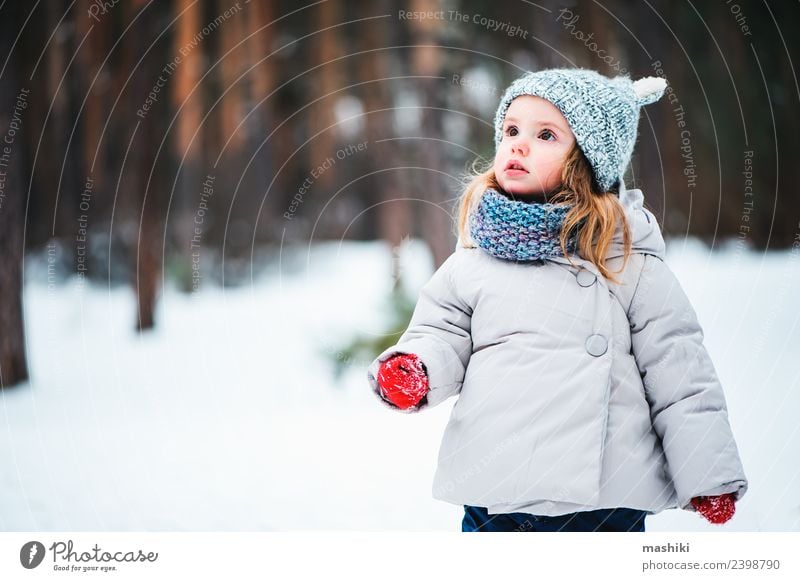 baby girl in knitted hat walking in winter forest Lifestyle Joy Beautiful Face Playing Vacation & Travel Winter Snow Child Baby Toddler Infancy Weather Tree