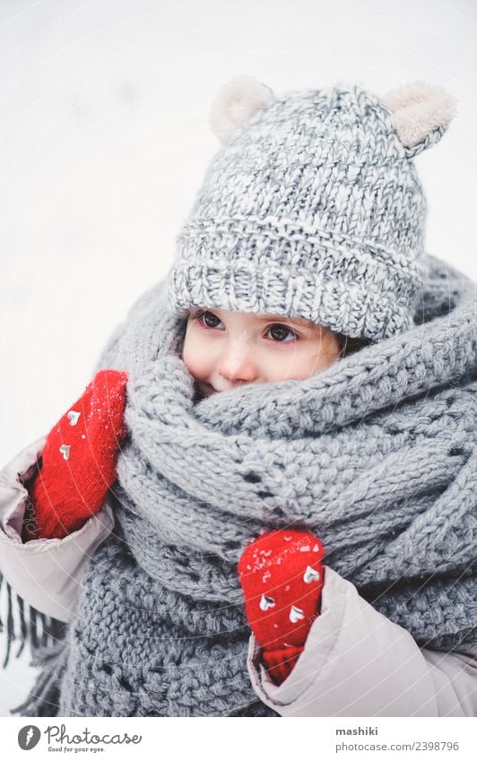 cute baby girl in knitted scarf walking in winter Lifestyle Joy Vacation & Travel Winter Snow Child Baby Toddler Infancy Weather Forest Fashion Coat Scarf Hat