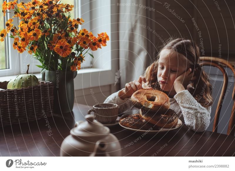 child girl having breakfast at home Breakfast Tea Lifestyle Happy House (Residential Structure) Decoration Chair Table Kitchen Child Family & Relations Autumn