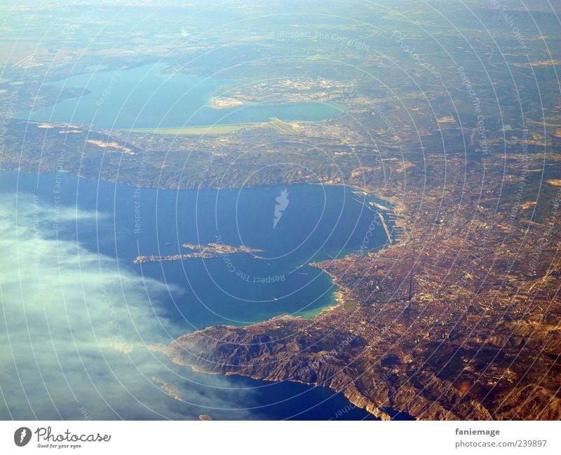 home flight Landscape Earth Sky Mountain Coast Ocean Port City View from the airplane Flying Blue Brown Uniqueness Far-off places Colour photo Aerial photograph